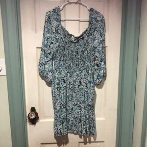 It’s blue with a flower Design. Perfect summer dress and it has pockets!!!